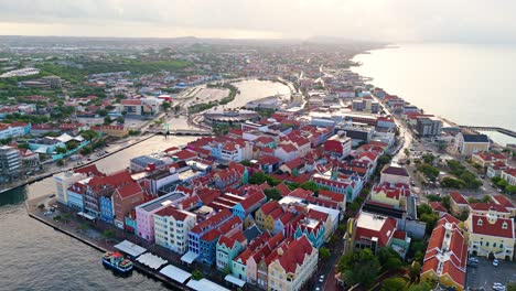 High-angle-aerial-pullback-above-Willemstad-Curacao-with-soft-morning-light