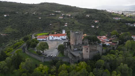 Drone-circles-around-medieval-castle-in-historic-city-center-of-Braganza-Portugal