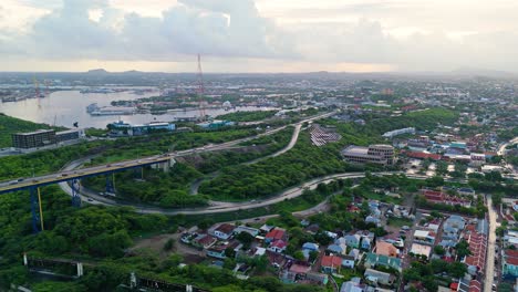 Panoramic-aerial-overview-of-winding-roads-after-Queen-Julianna-bridge-in-Willemstad,-Curacao