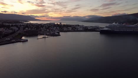 Sunset-over-cruise-ship-port-in-Akureyri,-Iceland