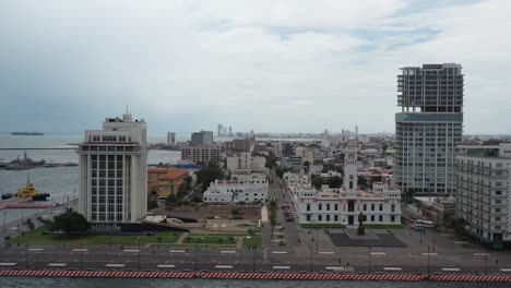Overlooking-Veracruz-port-city,-with-historic-architecture-in-the-foreground-and-modern-high-rises-near-the-sea