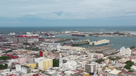 Aerial-Overlooking-the-historic-downtown-of-Veracruz,-Mexico,-this-vista-captures-the-vibrant-port's-synergy-of-commerce-and-culture
