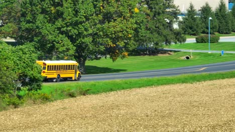 Yellow-school-bus-driving-in-rural-USA