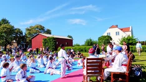 Taekwondo-Kids-are-Giving-New-Taekwondo-Belts-During-Outdoor-Ceremony
