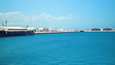 Panoramic-view-of-Limassol-Port,-featuring-boats,-buildings,-and-a-passenger-terminal