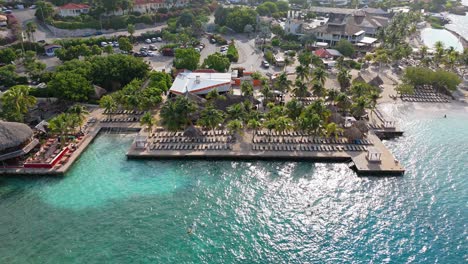 Drone-trucking-pan-along-Zanzibar-beach-Jan-Thiel-Curacao-with-stunning-clear-Caribbean-water