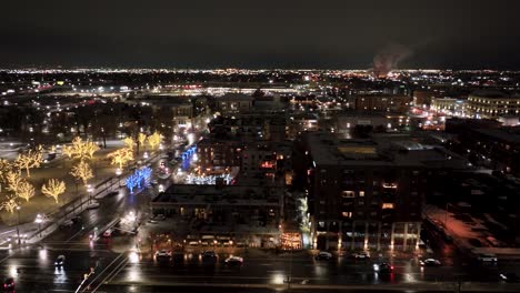Salt-Lake-City,-Utah-at-nighttime-with-Christmas-lights-and-the-skyline---aerial-panorama