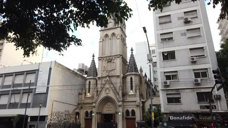 Streets-of-Buenos-Aires-City-Argentina-Immaculate-Virgin-of-Lourdes-Church-Sky-in-Spring,-Rivadavia-Avenue,-Pope-Francis-Neighborhood