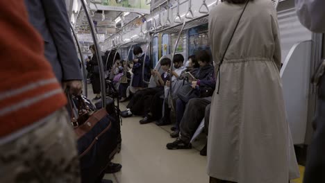 Commuters-in-the-Metro,-Tokyo,-Japan
