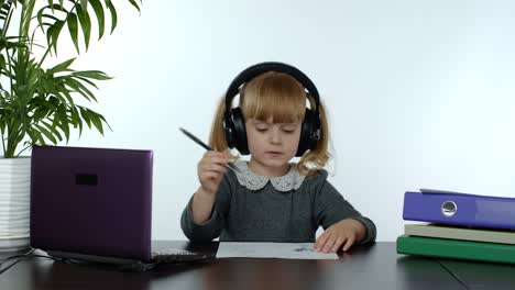 Online-learning,-distance-education,-lesson-at-home.-Girl-doing-school-program-online-on-computer