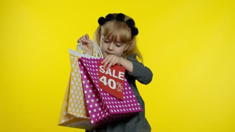 Pupil-girl-with-shopping-bags-showing-Up-To-40-percent-Off-banner-text-advertisement.-Holiday-sale