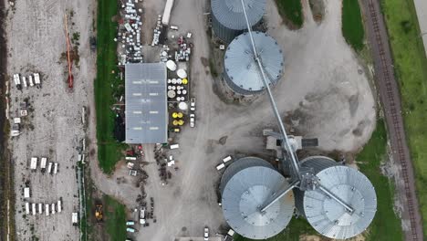 Aerial-view-of-industrial-grain-silos-and-storage-facilities-with-adjacent-railroad-track