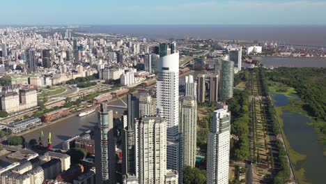 Buenos-Aires-skyline-where-urban-structures-meet-the-green-expanse-of-the-Ecological-Reserve,-near-the-river