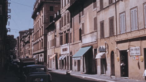 Men-Enter-a-Clothing-Store-in-the-Downtown-Area-of-Rome-in-the-1960s