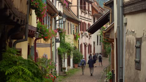 Charming-typical-little-Alsatian-village-of-Eguisheim-features-brightly-coloured-old-houses-with-pointed-roofs-and-timber-framed-façades