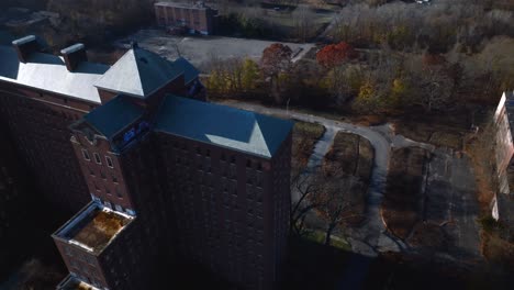 An-aerial-view-of-the-desolate-Kings-Park-Psychiatric-Center-on-a-sunny-day-on-Long-Island,-NY