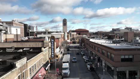 Downtown-Ann-Arbor,-Michigan-along-Liberty-Street-with-drone-video-moving-forward-and-low