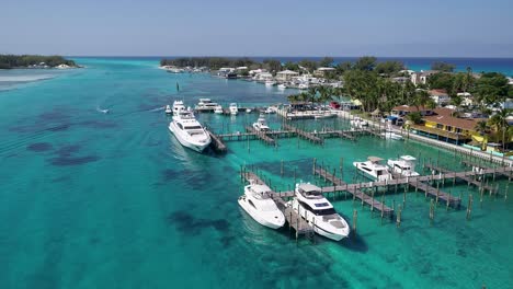 A-4K-drone-shot-of-the-Bimini-Blue-Water-Marina,-in-North-Bimini,-a-small-island-chain-found-off-the-coast-of-the-Bahamas