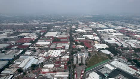 frontal-drone-sho-of-mexico-city-industrial-zone-in-a-cloudy-day