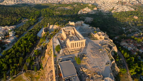 Pan-up-reveal-aerial-shot-over-the-Acropolis-at-sunrise