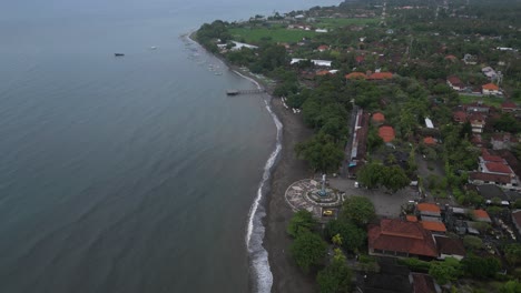 Lovina-beach-in-Bali-on-a-rainy-afternoon-with-beach-and-sea-views,-aerial