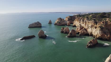 Cliffside-Sea-Stacks-of-Portimão-Coast,-Algarve,-Portugal---Aerial
