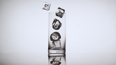 Multiple-Ice-Cubes-Falling-into-an-Empty-Glass