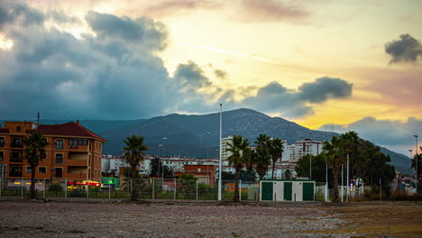 Timelapse-shot-of-traffic-movement-along-the-Costa-Del-Sol-in-Malaga,-Andalusia-province,-Spain-with-mountains-in-the-background-during-evening-time