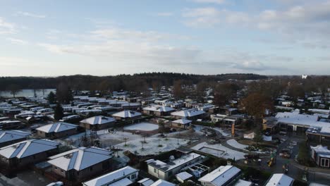 Snowy-Roofs-in-Dutch-Bungalow-Park.-Aerial-Fly-over