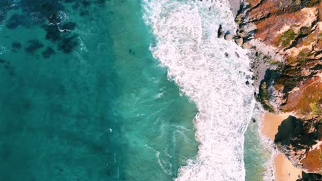 Slow-motion-seaside-turquoise-water-and-waves-at-sandy-beach