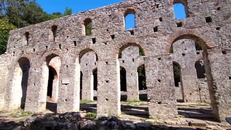 Medieval-Great-Cathedral-Walls,-Adorned-with-Majestic-Arches,-Stand-Proudly-as-Timeless-Witnesses-on-Butrint's-Archaeological-Site