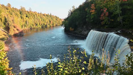 View-of-Tahquamenon-Falls-with-rainbow-in-mist-at-autumn