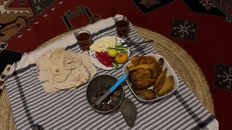 Simple-healthy-food-breakfast-table-fresh-organic-material-bread-cookies-vegetable-in-rural-lifestyle-town-Iran-Gilan-Rasht-couple-life-in-middle-east-at-night-morning-vibe-Persian-carpet-table-cloth