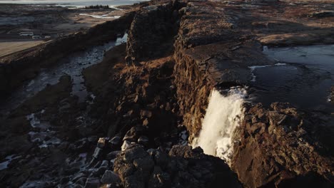 Dramatic-waterfall-Oxararfoss-in-thingvellir-national-park-Iceland,-aerial