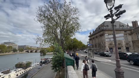 Stroll-along-the-Seine's-scenic-banks-in-Paris,-where-timeless-beauty-meets-the-river's-gentle-embrace