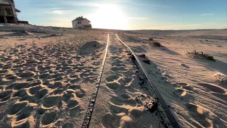 Train-tracks-covered-in-sand-in-the-ghost-town-of-Kolmannskuppe-Namibia