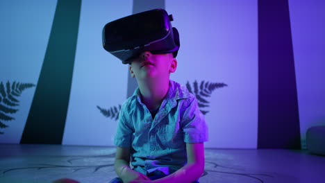 Male-kid-with-VR-glasses-interacting-with-an-artificial-world,-close-up-shot