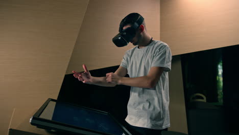 Man-using-a-VR-headset-with-motion-tracking-tech,-make-hand-gestures-in-the-air