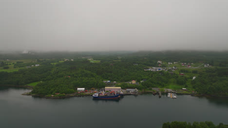 Aerial-View-Of-Ship-Dock-Near-Coastal-Village-In-West-Coast-Norway-During-Foggy-Morning