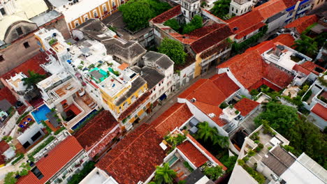 Top-down-aerial-drone-view-over-the-streets-of-Cartagena's-historical-old-town-in-Colombia