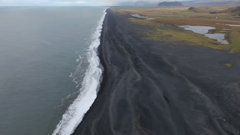 Long-Black-Sand-Beach-In-Dyrhólaey-Peninsula,-Southern-Coast-Of-Iceland