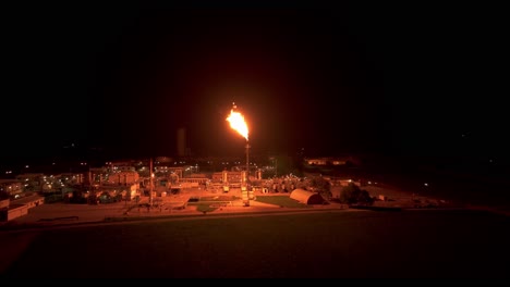 The-Surrounding-Area-is-Illuminated-by-the-Radiant-Light-Emitted-from-Gas-Flaring---Aerial-Panning