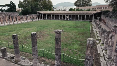 Gladiators'-Barracks-with-towering-columns-in-Pompeii,-Italy