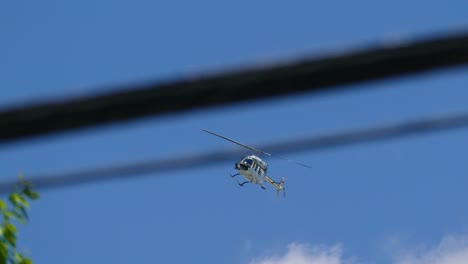 Helicopter-hovering-over-the-activists-marching-in-the-streets-of-Québec-City,-who-are-protesting-against-the-G7-Summit-held-in-Québec,-Canada