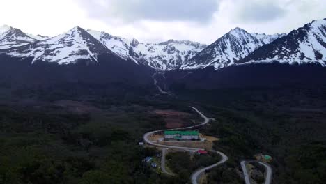 Drone-shot-flying-towards-the-Andes-mountains-and-the-Wyndham-Garden-Hotel-in-Ushuaia,-Argentina
