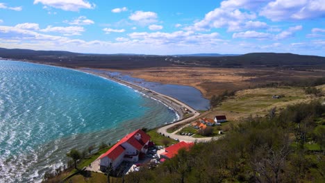 Drone-shot-flying-over-the-Hosteria-Kaiken-at-the-shores-of-Lake-Fagnano-in-Tierra-del-Fuego,-Argentina