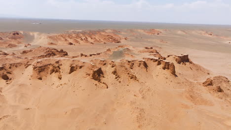 Sandstone-Rocks---Flaming-Cliffs-,-Gobi-Desert-In-Mongolia---Drone-Shot