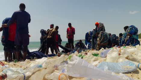 Plastic-waste-on-an-African-beach-with-fishermen-around