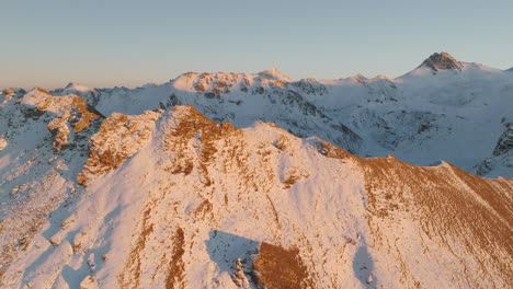 Mont-Noble-Snowy-Summit-Sunlit-During-Golden-Hour-in-Valais,-Switzerland