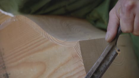 Close-Up-Shot-Of-Worker-Cutting-Wood-Carefully,-Wood-Artisan-Work